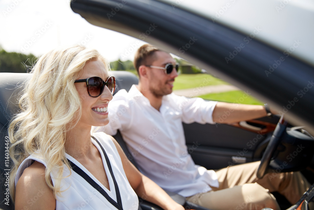 happy man and woman driving in cabriolet car happy man and woman driving in cabriolet car