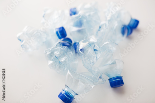 close up of empty used plastic bottles on table