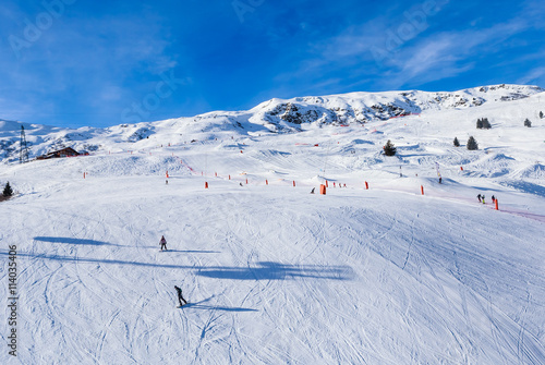 Unidentified skiers enjoy skiing at the slope in the  Alps. Ski © Nikolai Korzhov