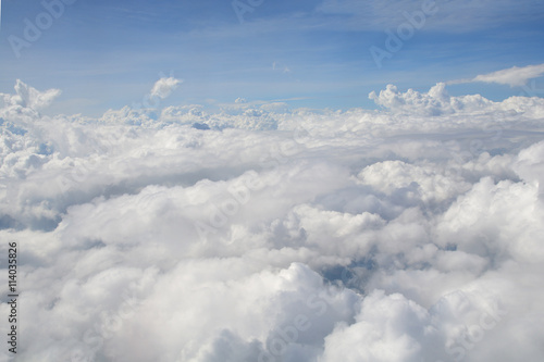 View from the window of an airplane flying in the clouds
