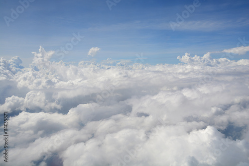 View from the window of an airplane flying in the clouds