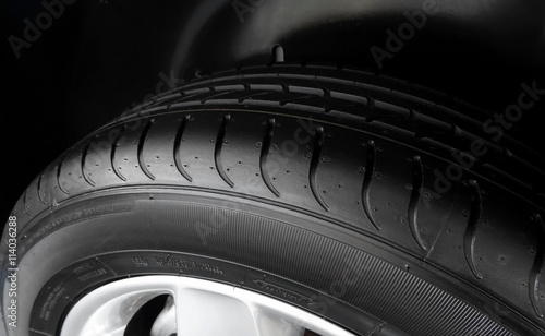 Dimples and sipes on the sidewall of summer tire detailed  photo