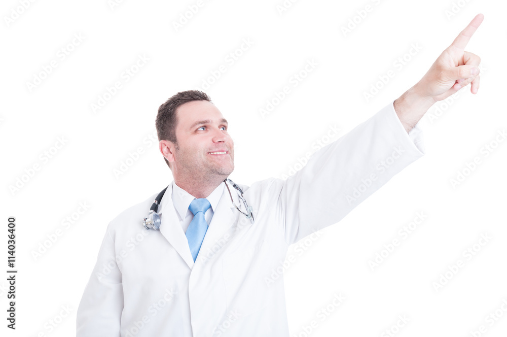 Male doctor or medic looking and pointing up feeling positive Male doctor or medic looking and pointing up feeling positive