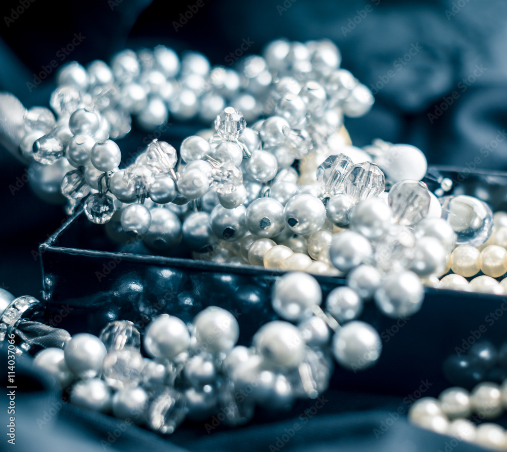 Pearl necklace with blurred background on black Pearl necklace with blurred background on black