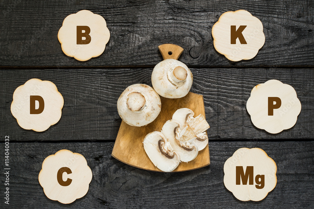 Fresh champignon on a cutting board Fresh champignon on a cutting board