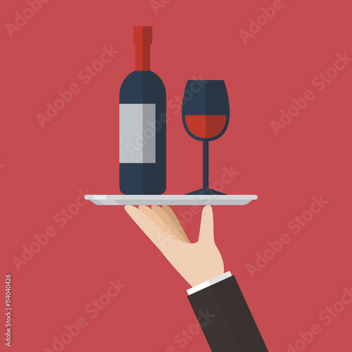 Waiter serving a wine bottle and wine glass