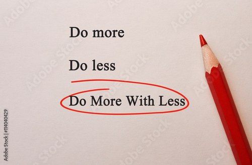 Fotografie Do More With Less in red circle with pencil on textured paper