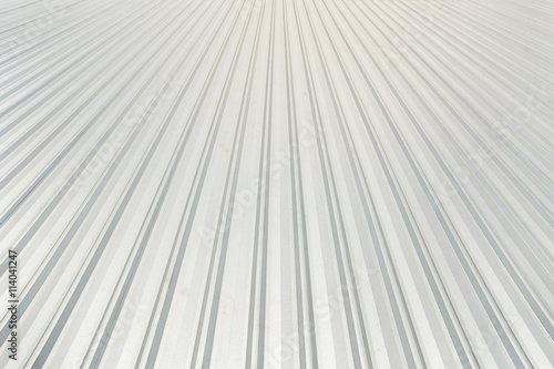 metal sheet roofing on commercial construction with blue sky photo