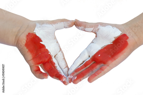 Childrens hands painted Polish flag -white and red. Isolated on white 