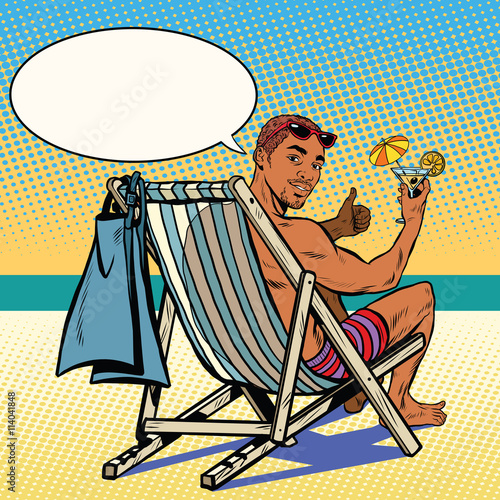 Handsome black man resting on the beach