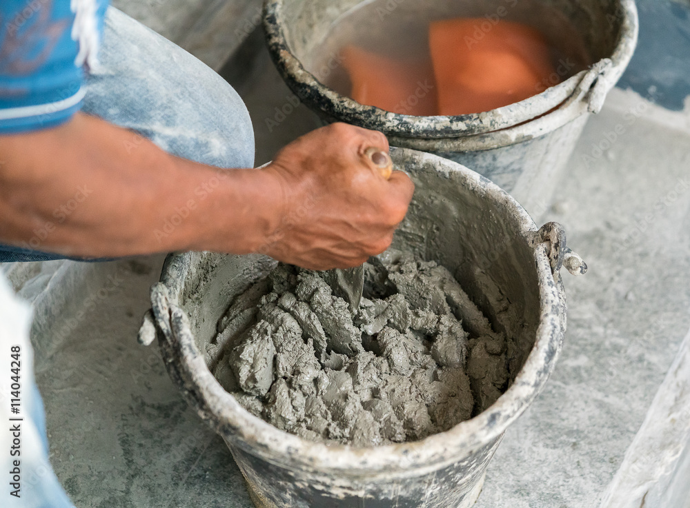 cement portland gray fresh mortar mix with spatula tool in bucket
cement portland gray fresh mortar mix with spatula tool in bucket
