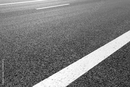 Asphalt road with marking lines white stripes