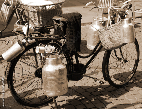 old bicycle of milkman for transporting milk cans
