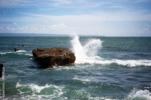 Surf breaking over rocks