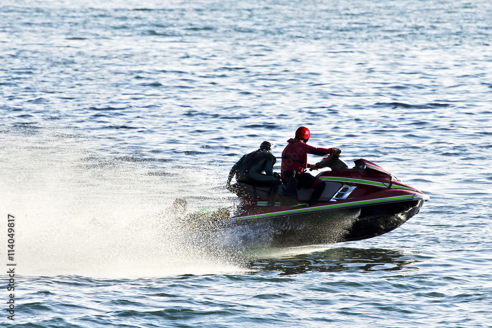 Fototapeta premium lifeguards in jet ski in rescue training