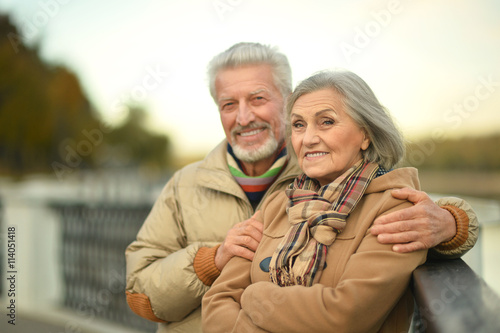 senior couple near river