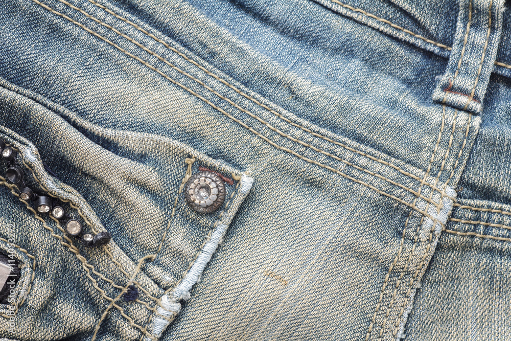 Closeup denim jeans texture. Stitched textured blue denim jeans background. Old grunge vintage denim jeans. Denim jeans fashion design. Closeup denim jeans texture. Stitched textured blue denim jeans background. Old grunge vintage denim jeans. Denim jeans fashion design.