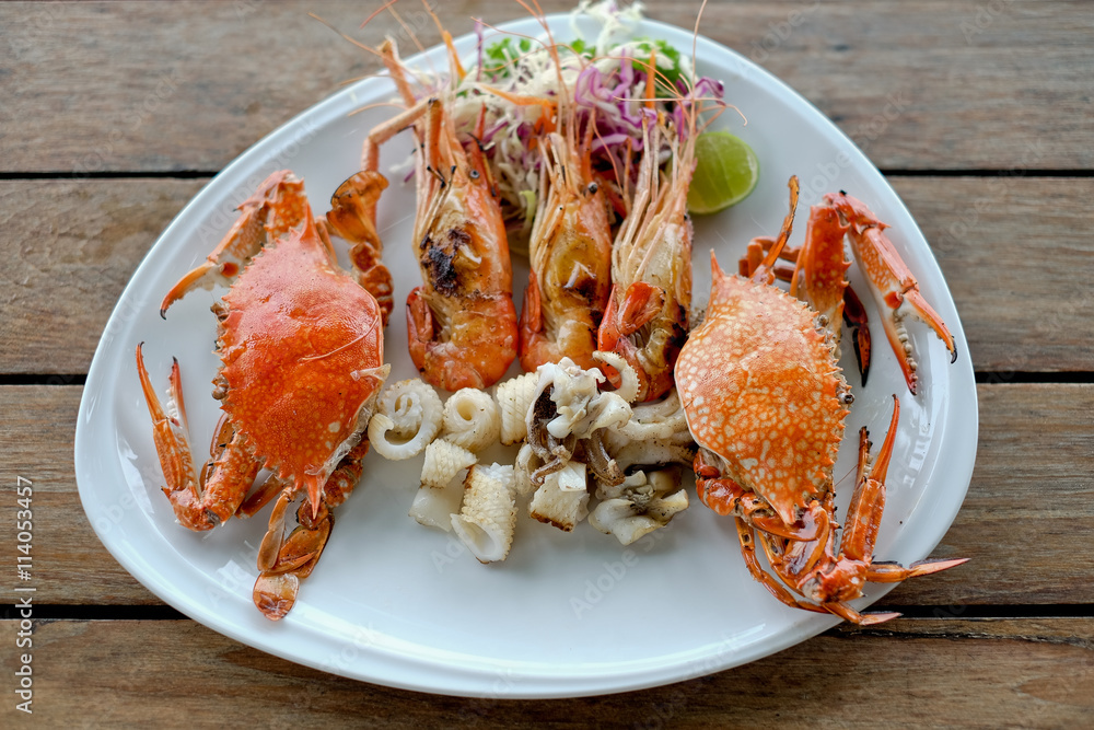 seafood of Grilled on wooden table at the beach seafood of Grilled on wooden table at the beach