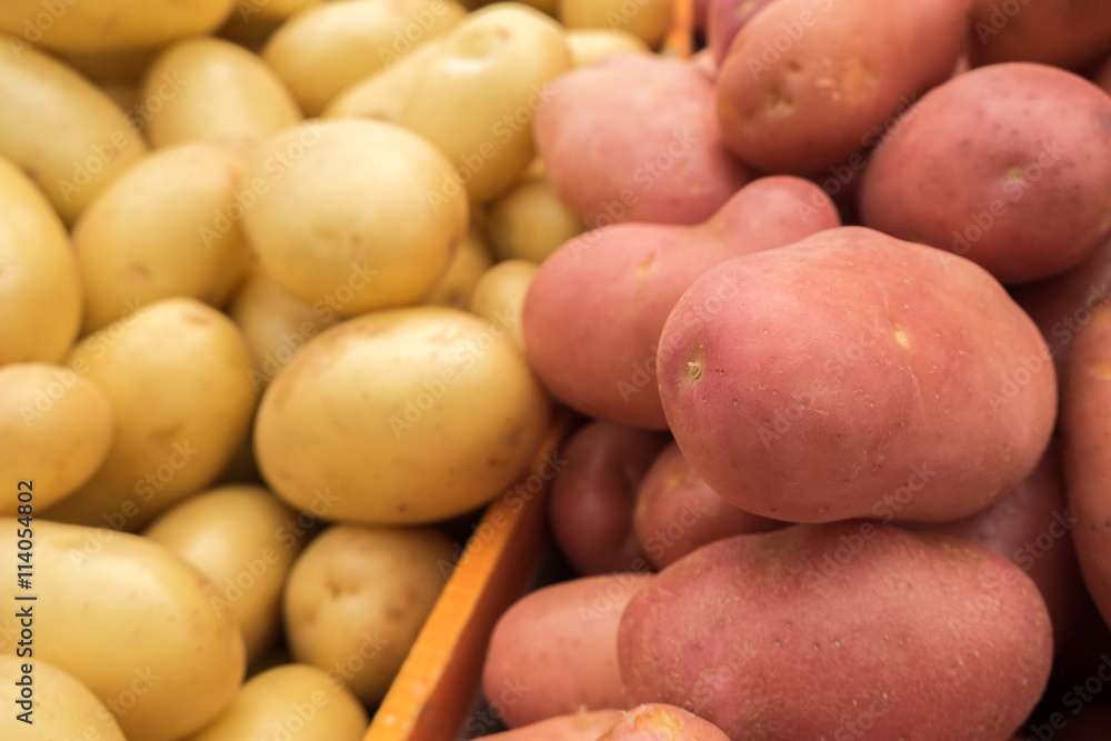 Fresh red and white new potatoes at market Fresh red and white new potatoes at market