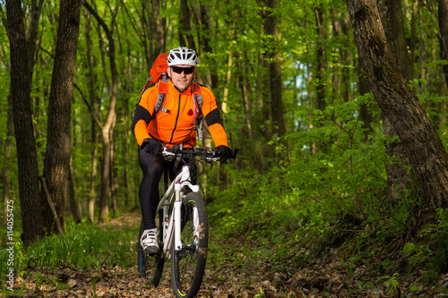 healthy lifestyle and fitness concept with mount bike man outdoor