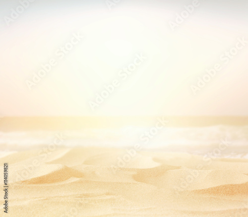 Abstract blurry high key image of empty sand beach