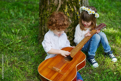cute children playing guitar © Aliaksei Lasevich
