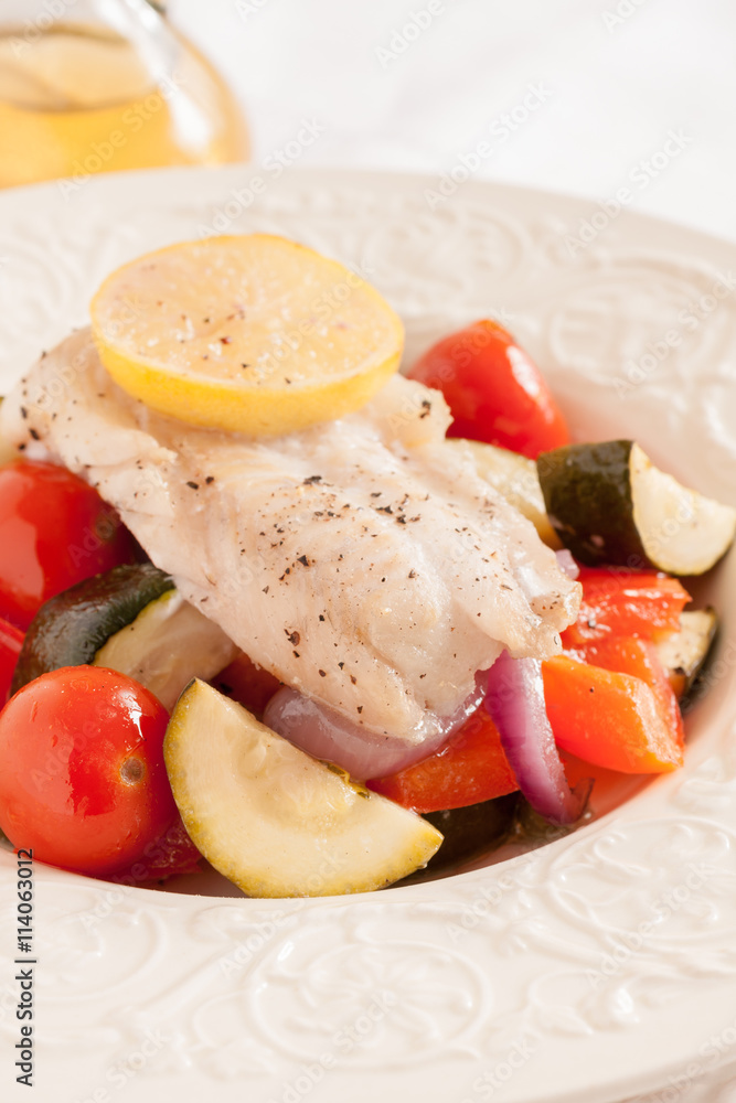Fish Provencal a seafood dish of roasted mediterranean vegetables and white fish 