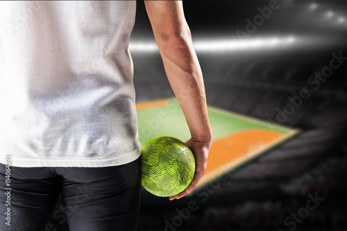 Composite image of mid section of athlete man holding ball  © vectorfusionart