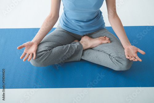 Woman practicing yoga at home