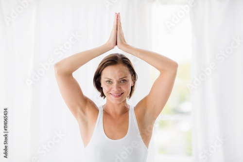 Portrait of smiling woman doing yoga