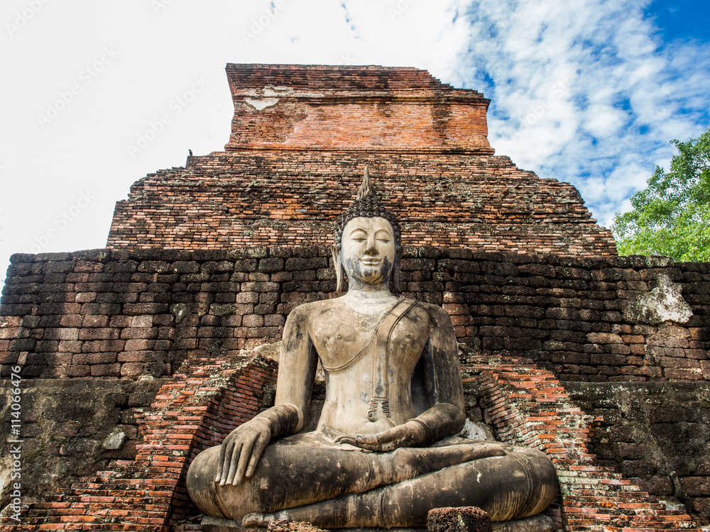 An ancient buddha statue at Mahathat Temple in Sukhothai Historical Park, Sukhothai, Thailand. An ancient buddha statue at Mahathat Temple in Sukhothai Historical Park, Sukhothai, Thailand.