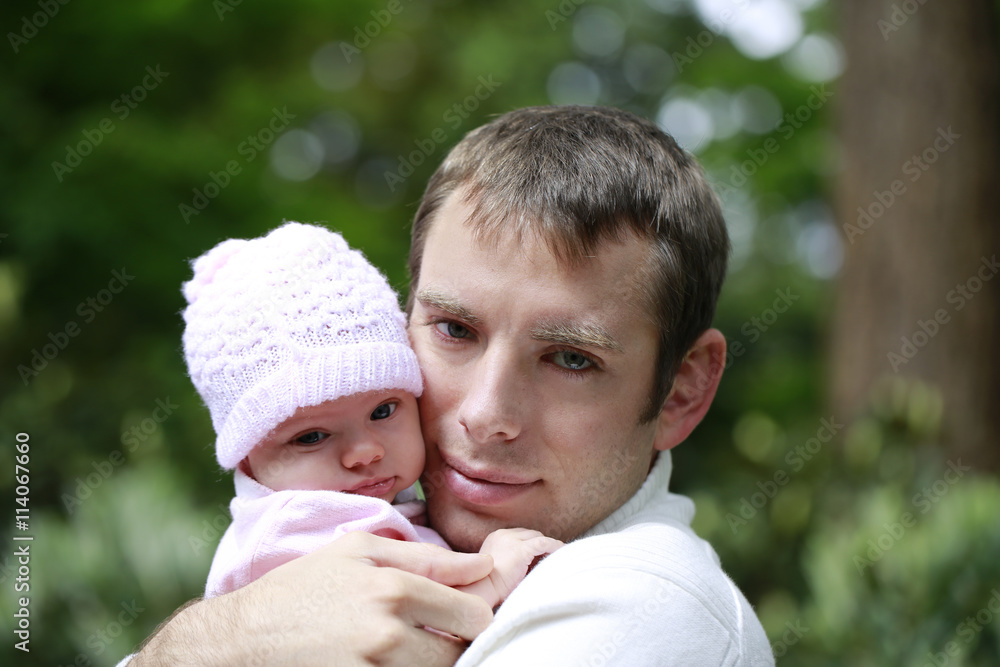 Close portrait of a loving father hugging little daughter Close portrait of a loving father hugging little daughter