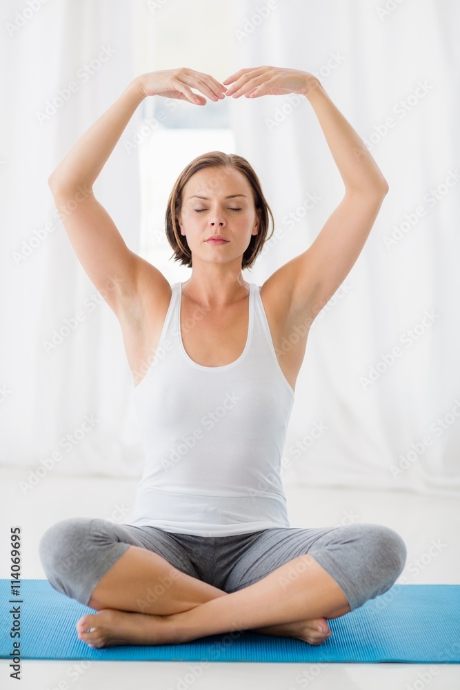 Full length of woman doing yoga Full length of woman doing yoga