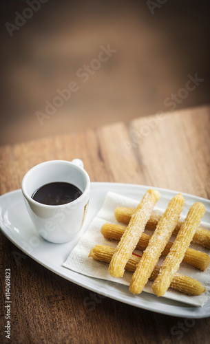 churros and chocolate spanish donuts with sauce breakfast snack