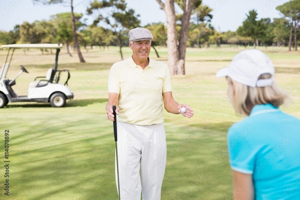 Mature golfer couple 