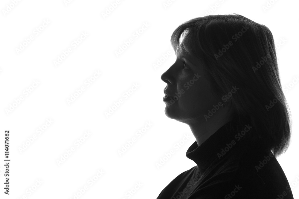 silhouette of a sad pensive woman