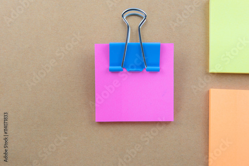 Color Paper notes with sticky note on brown Background