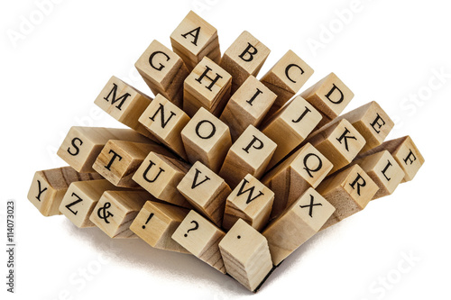 Letters of the English alphabet on the ends of wooden bars, isol