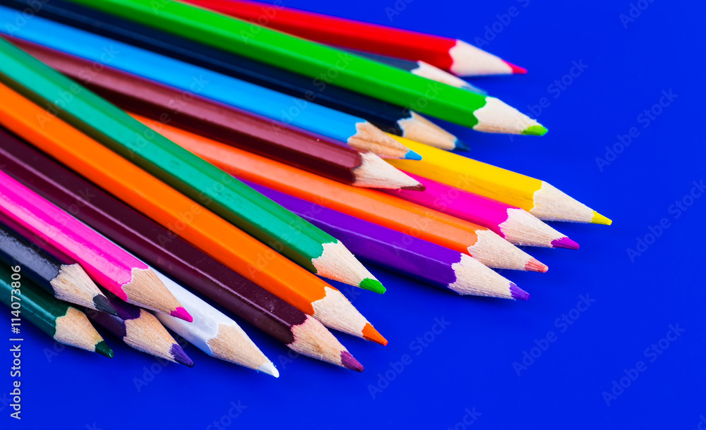 Colorful pencils isolated on a blue background Colorful pencils isolated on a blue background