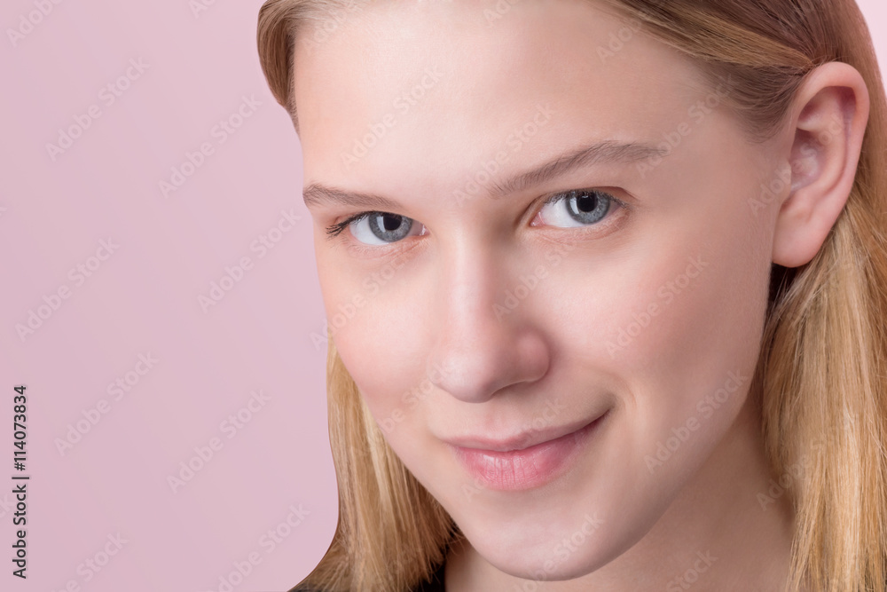 Portrait of a beautiful teen girl over pink background Portrait of a beautiful teen girl over pink background