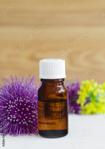 Small bottle of burdock extract (oil, tincture, infusion)