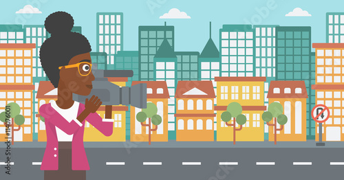 Camerawoman with video camera.