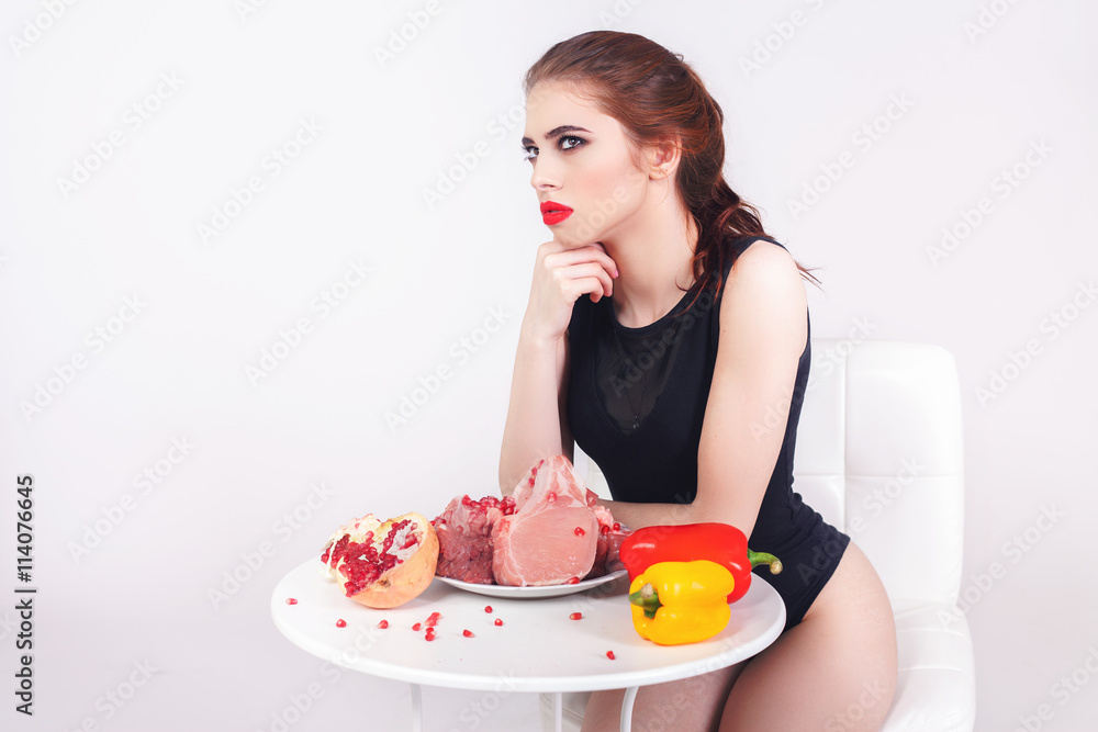 Image of healthy eating. Woman eating flesh meat at restaurant Image of healthy eating. Woman eating flesh meat at restaurant