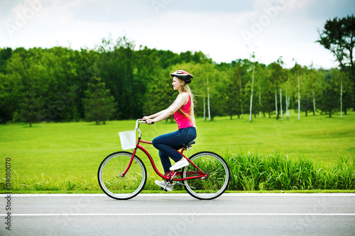 .young girl riding a bicycle in a park