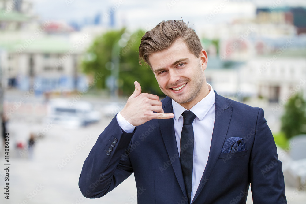 Call Me. Portrait of a cheerful businessman in black suit Call Me. Portrait of a cheerful businessman in black suit
