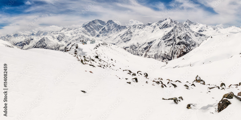 Panorama of the main Caucasus ridge and peak Terskol with Observatory in the foreground