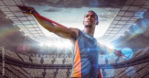 Schilderij op canvas Composite image of sportsman is practising javelin throw