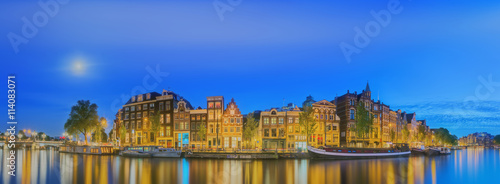 Amstel river  canals and night view of beautiful Amsterdam city. Netherlands