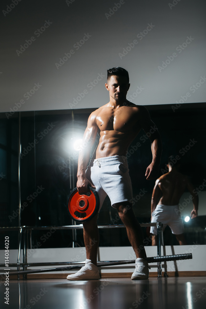Fototapeta premium muscular man with barbell