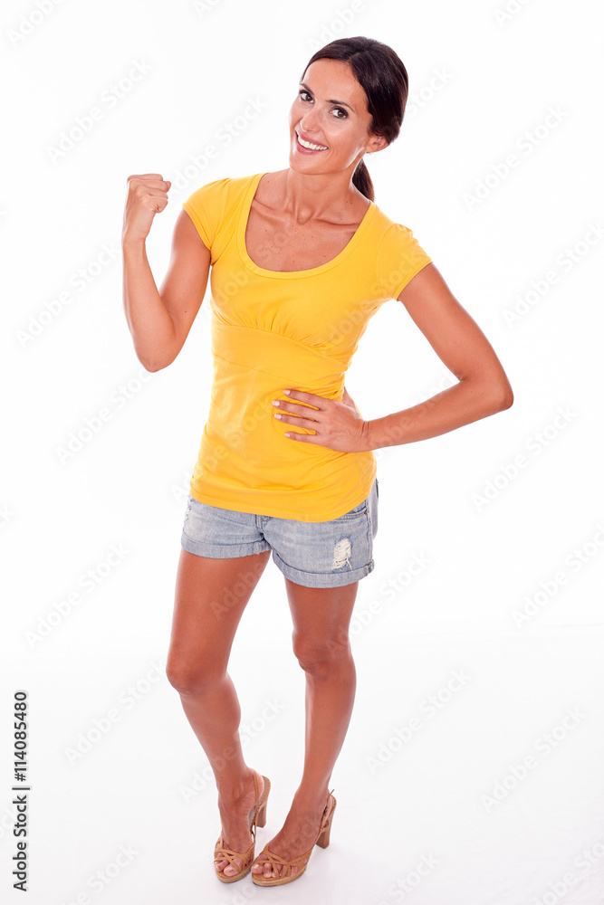 Celebrating adult woman smiling at camera Celebrating adult woman smiling at camera